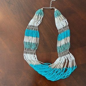 Turquoise and white beaded necklace.